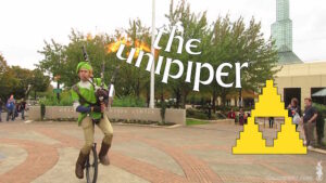 SPUND! Link, su un monociclo, che suona una cornamusa sputafiamme